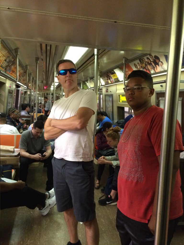 Riding the subway to meet up with cousin Kelli. They've got their don't-mess-with-me faces on.