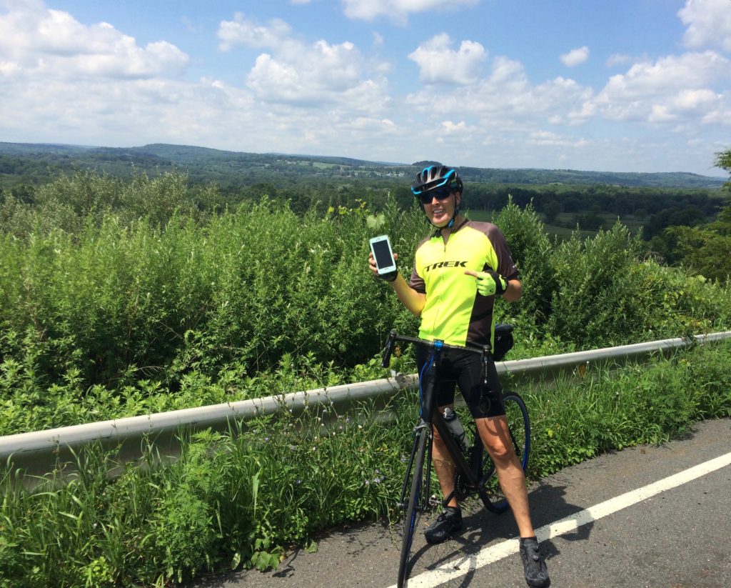About seven miles into the ride, Ron finds an iPhone 6s along the roadside! He calls the most recent number and leaves a message. Then he calls another number and reaches the owner's sister. She gives us an address and we bike there. 